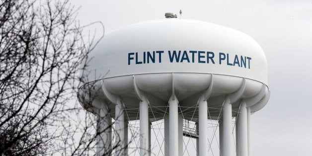 FILE - This Feb. 5, 2016 file photo shows the Flint Water Plant tower in Flint, Mich. Michigan, seeking to prevent another oversight fiasco after lead poisoning in Flint and a deadly Legionnaires' disease outbreak in the area, is considering new water testing rules for hospitals and possible changes to how large facilities manage their water systems that could include new monitoring requirements. (AP Photo/Carlos Osorio, File)