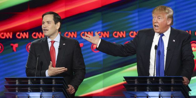 Donald Trump, president and chief executive of Trump Organization Inc. and 2016 Republican presidential candidate, right, and Senator Marco Rubio, a Republican from Florida and 2016 presidential candidate, speak during the Republican presidential primary candidate debate sponsored by CNN and Telemundo at the University of Houston in Houston, Texas, U.S., on Thursday, Feb. 25, 2016. Trump holds a substantial lead in the southern region where Republican voters have their say on March 1, displaying remarkable strength for a twice-divorced New Yorker in Bible Belt states home to some of the nation's most conservative voters. Photographer: Gary Coronado/Pool via Bloomberg 