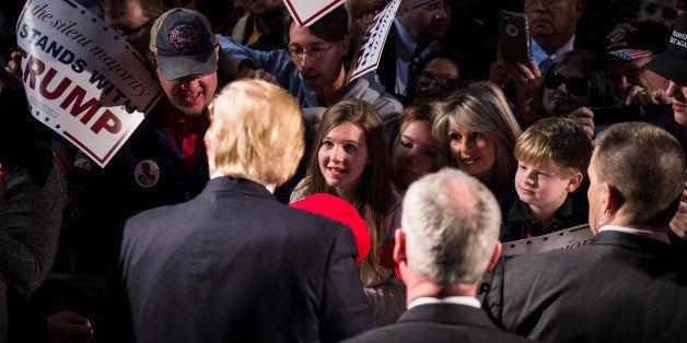 MILLINGTON, TN - FEBRUARY 27: People reach for signatures, photos, and handshakes as republican presidential candidate Donald Trump greets the crowd after speaking at a campaign event in Millington, TN on Saturday Feb. 27, 2016. (Photo by Jabin Botsford/The Washington Post via Getty Images)