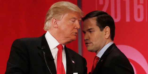 Republican presidential candidate, Sen. Marco Rubio, R-Fla., right, right, speaks to Republican presidential candidate, businessman Donald Trump during a commercial break during the CBS News Republican presidential debate at the Peace Center, Saturday, Feb. 13, 2016, in Greenville, S.C. (AP Photo/John Bazemore)