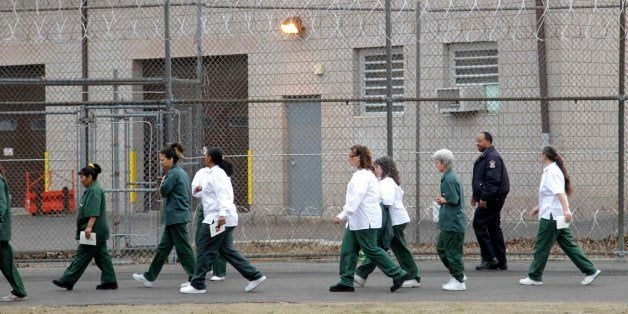 Women walk on a road at the women-only Taconic Correctional Facility in Bedford Hills, N.Y., Wednesday, March 28, 2012. (AP