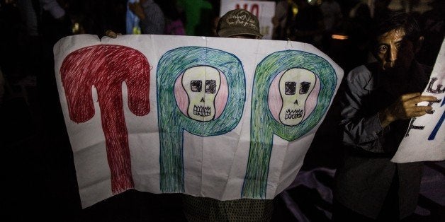 LIMA, PERU - FEBRUARY 25 : Demonstrators participate in a protest against the signing of the Trans-Pacific Partnership (TPP), in Lima, Peru, on February 25, 2016. (Photo by Sebastian Castaneda/Anadolu Agency/Getty Images)