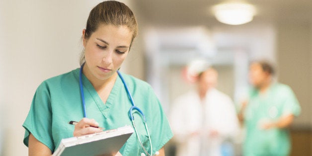 USA, New Jersey, Jersey City, Female doctor in hospital hallway