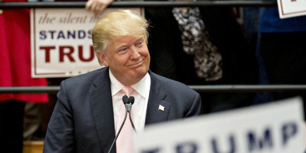 Donald Trump, president and chief executive of Trump Organization Inc. and 2016 Republican presidential candidate, smiles whi