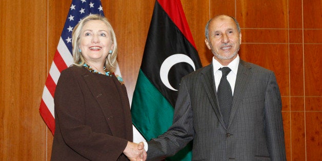 U.S. Secretary of State Hillary Rodham Clinton meets with Libya Transitional National Council President Mustafa Abdel-Jalil at the World Islamic Call Society Headquarters during a visit to Tripoli in Libya Tuesday Oct. 18, 2011. (AP Photo/Kevin Lamarque, Pool)