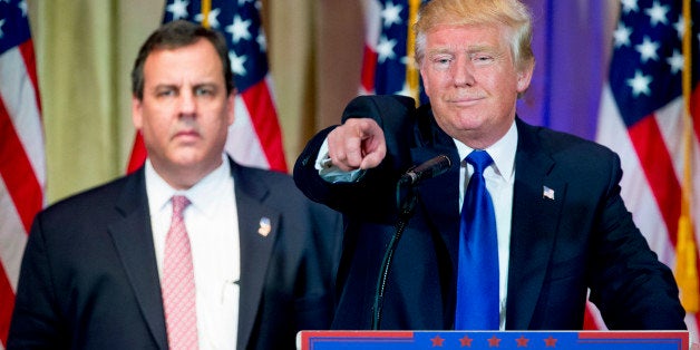 Republican presidential candidate Donald Trump, accompanied by New Jersey Gov. Chris Christie, left, takes questions from members of the media during a news conference on Super Tuesday primary election night in the White and Gold Ballroom at The Mar-A-Lago Club in Palm Beach, Fla., Tuesday, March 1, 2016. (AP Photo/Andrew Harnik)