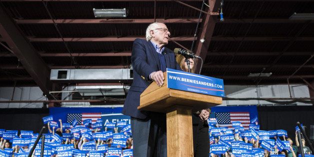 Senator Bernie Sanders, an independent from Vermont and 2016 Democratic presidential candidate, speaks on stage with wife Jane Sanders during a Super Tuesday night rally in Essex Junction, Vermont, U.S., on Tuesday, March 1, 2016. Sanders raised $42 million in February, his campaign said Tuesday. The Vermont senator, who has set grassroots fundraising records this cycle, raised $21.3 million in January, compared to $14.9 million raised by the party's front-runner, Hillary Clinton. Photographer: Ian Thomas Jansen-Lonnquist/Bloomberg via Getty Images 