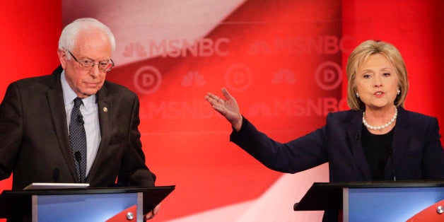 Democratic presidential candidate, Sen. Bernie Sanders, I-Vt, listens as Democratic presidential candidate, Hillary Clinton answers a question during a Democratic presidential primary debate hosted by MSNBC at the University of New Hampshire Thursday, Feb. 4, 2016, in Durham, N.H. (AP Photo/David Goldman)