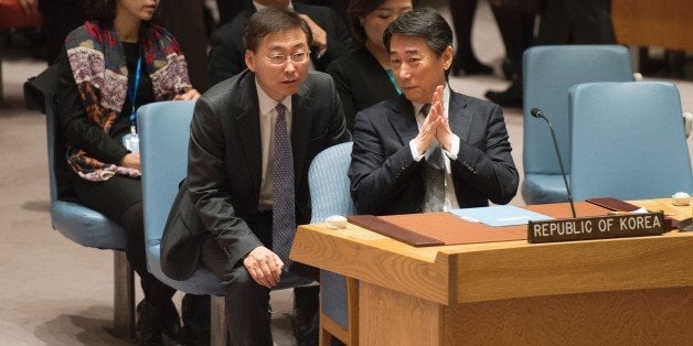 South Korea's delegation to the UN lead by Ambassador Oh Joon (R) talkS before a vote during a United Nations Security Council meeting on sanctions against North Korea March 2, 2016 at the United Nations in New York. / AFP / Don EMMERT (Photo credit should read DON EMMERT/AFP/Getty Images)