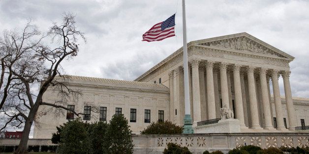 In honor of Justice Antonin Scalia who died on Feb. 13, 2016, the flags in the Supreme Court building's front plaza will continue to fly at half-staff for a month, in Washington, Thursday, Feb. 25, 2016. Scaliaâs unexpected death triggered an election-year political standoff on Capitol Hill as leaders in the GOP-controlled Congress insist President Obama should not nominate a replacement for Scalia and should leave that for the next president who is elected in November. (AP Photo/J. Scott Applewhite)