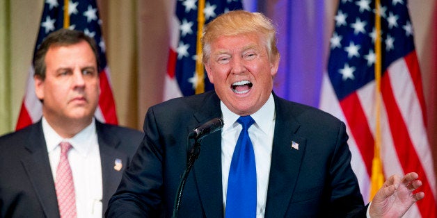 Republican presidential candidate Donald Trump, accompanied by New Jersey Gov. Chris Christie, left, speaks during a newsconference on Super Tuesday primary election night in the White and Gold Ballroom at The Mar-A-Lago Club in Palm Beach, Fla., Tuesday, March 1, 2016. (AP Photo/Andrew Harnik)