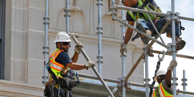 Workers build scaffolding at the state Capitol in Oklahoma City, Thursday, June 11, 2015. Assessments and test phases of exterior repair are beginning on the nearly 100-year-old building. The Oklahoma Legislature approved a $120 million bond issue last year to pay for renovations to the building. (AP Photo/Sue Ogrocki)