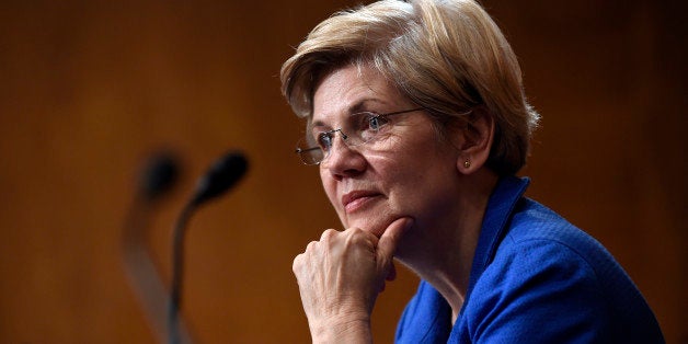 Sen. Elizabeth Warren, D-Mass., listens to Federal Reserve Chair Janet Yellen testify before the Senate Banking, Housing, Urban Affairs Committee on Capitol Hill in Washington, Thursday, July 16, 2015. (AP Photo/Susan Walsh)