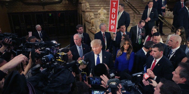 DETROIT, MI - MARCH 03: Republican presidential candidate Donald Trump greets reporters in the spin room following a debate