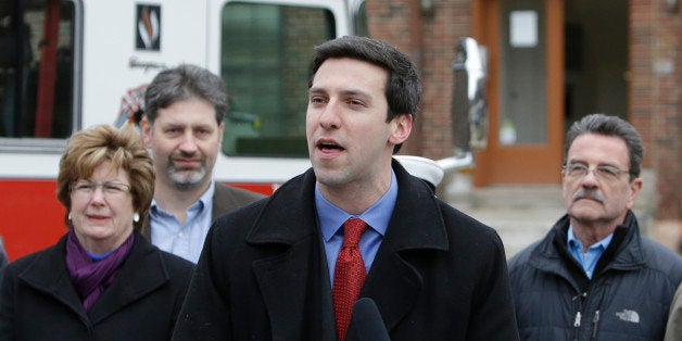 FILE - In this Feb. 19, 2013 file photo, Cincinnati City Councilman P.G. Sittenfeld, front, speaks during a news conference i