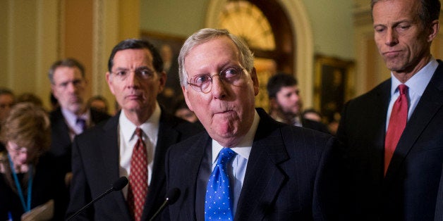 UNITED STATES - MARCH 1: Senate Majority Leader Mitch McConnell (R-KY) flanked by Sen. John Barrasso (R-WY) left and Sen. John Thune (R-SD) right speaks to the media in the Ohio Clock Corridor following the Senate Republicans' policy lunch in the Capitol on March 1, 2016. (Photo By Bill Clark/CQ Roll Call)