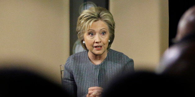 Democratic presidential candidate Hillary Clinton speaks with African American ministers, Saturday, March 5, 2016, in Detroit. (AP Photo/Carlos Osorio)