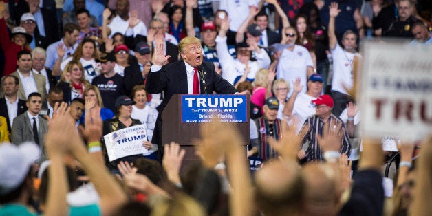 ORLANDO, FL - MARCH 5: Republican presidential candidate Donald Trump guides everyone to pledge to vote for him as he speaks