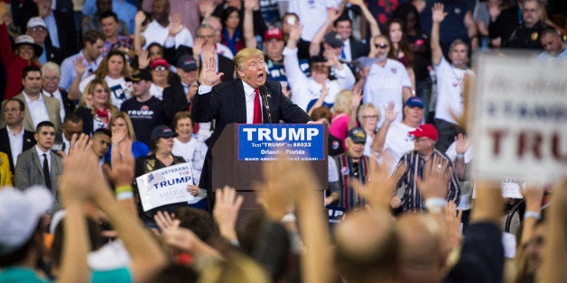 ORLANDO, FL - MARCH 5: Republican presidential candidate Donald Trump guides everyone to pledge to vote for him as he speaks during a campaign event at the CFE Federal Credit Union Arena in Orlando, FL on Saturday March 05, 2016. (Photo by Jabin Botsford/The Washington Post via Getty Images)