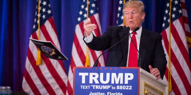 JUPITER, FL - MARCH 8: Republican presidential candidate Donald Trump throws his magazine as he speaks during a campaign pres