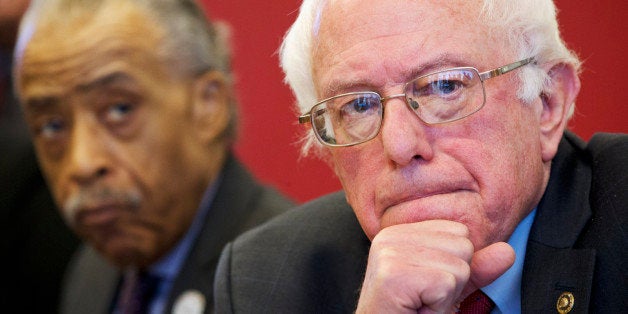 Democratic presidential candidate, Sen. Bernie Sanders, I-Vt., accompanied by Rev. Al Sharpton, President of the National Action Network, listens as leaders of nine historic civil rights groups voice their concerns, during a meeting at the National Urban League Washington Bureau in Washington, Thursday Feb. 18, 2016. (AP Photo/Jacquelyn Martin)