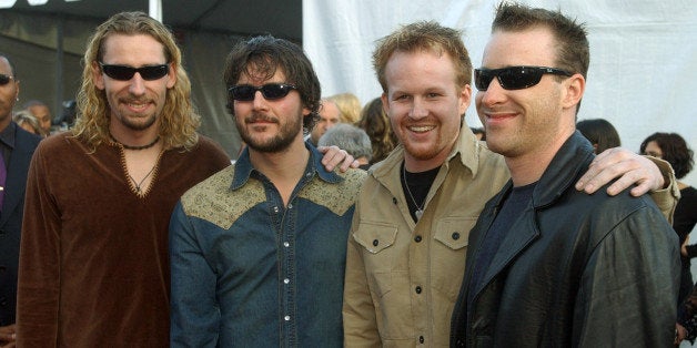 Canadian rock group Nickelback arrives at the 30th annual American Music Awards Monday, Jan. 13, 2003, in Los Angeles. Nickelback is nominated for the Favorite Band, Duo or Group-Pop or Rock 'n Roll Music award. (AP Photo/Chris Pizzello)