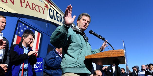 KANSAS CITY, KS October 31: Kansas Governor Sam Brownback talks with supporters during the 'Vote the Kansas way bus tour'