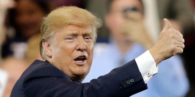 Republican presidential candidate, Donald Trump, gives a thumbs up after speaking at a campaign rally at the I-X Center Saturday, March 12, 2016, in Cleveland. (AP Photo/Tony Dejak)