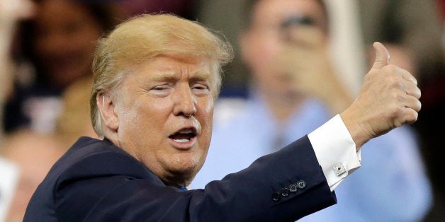 Republican presidential candidate, Donald Trump, gives a thumbs up after speaking at a campaign rally at the I-X Center Satur