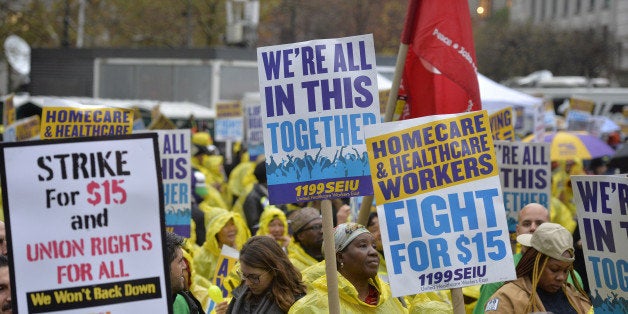 NEW YORK CITY, Nov. 10, 2015-- People attend the strike in support of a $15-per-hour minimum wage in New York City, the United States, Nov. 10, 2015. Hundreds of fast food workers took part in strike nationwide Tuesday, joining other workers in pressing for a more livable wage. (Xinhua/Wang Lei via Getty Images)