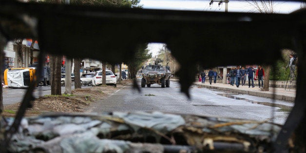 DIYARBAKIR, TURKEY - MARCH 15: A military vehicle inspects the streets after fighting between members of the PKK and the police on March 15, 2016 in Diyarbakir, Turkey. Heavy fighting between members of Kurdistan Workers Party (PKK) and Police forces have left at least three people dead and several injured. President Recep Tayyip Erdogan vowed a crackdown on the PKK following Sunday's suicide bomb attack in Ankara, which has been widely blamed on the Kurdish separatist group. (Photo by Awakening/Getty Images)