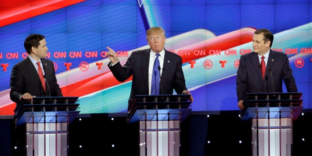 Republican presidential candidate, businessman Donald Trump, center, speaks as Republican presidential candidate, Sen. Marco