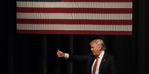 HICKORY, NC - MARCH 14: Republican presidential candidate Donald Trump exits the stage during a campaign rally at Lenoir-Rhyn