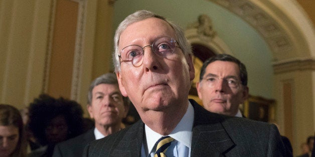 Senate Majority Leader Mitch McConnell, R-Ky., flanked by Sen. Roy Blunt, R-Mo., left, and Sen. John Barrasso, R-Wyo., right, talks to reporters following a closed-door policy meeting at the Capitol in Washington, Tuesday, March 8, 2016. (AP Photo/J. Scott Applewhite)