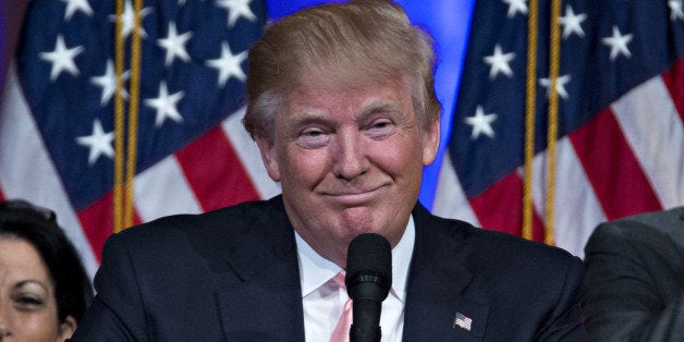 Donald Trump, president and chief executive of Trump Organization Inc. and 2016 Republican presidential candidate, smiles whi
