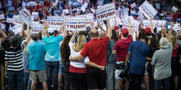 ORLANDO, FL - MARCH 5: Patrons cheer as republican presidential candidate Donald Trump speaks during a campaign event at the