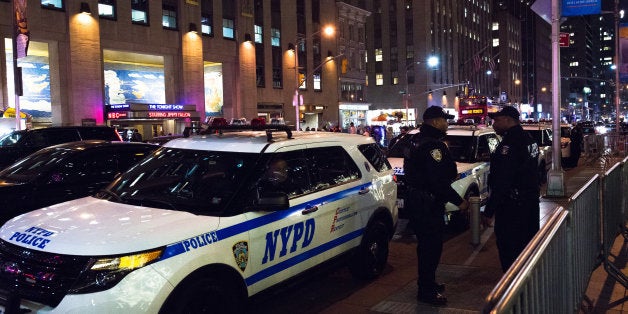 ROCKEFELLER CENTER, NEW YORK, NY, UNITED STATES - 2015/12/10: Officers from the NYPD's Strategic Response Group stand alert by their service vehicles on Seventh Avenue. Amid growing concern for the possibility of a terror attack in New York City. NYPD counter-terrorism officers maintain alert status near Rockefeller Center, a popular seasonal attraction in Midtown Manhattan. (Photo by Albin Lohr-Jones/Pacific Press/LightRocket via Getty Images)