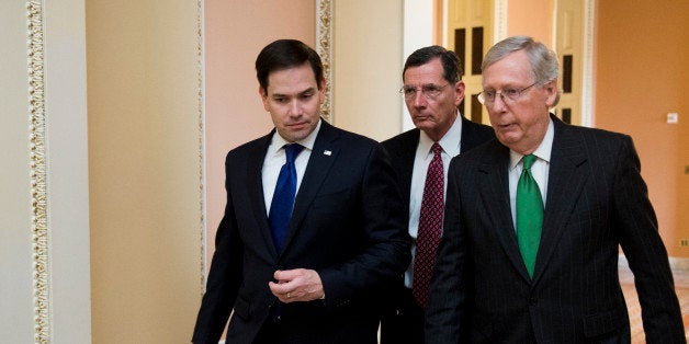 UNITED STATES - MARCH 17: From left, Sen. Marco Rubio (R-FL) speaks with Sen. John Barrasso (R-WY) and Senate Majority Leader