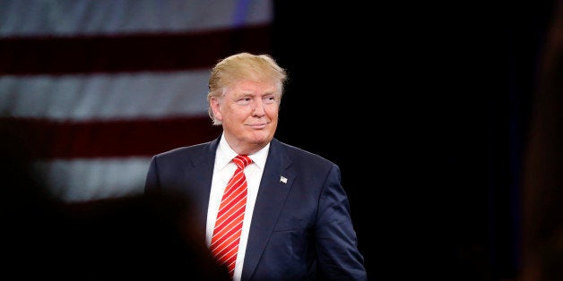 Republican presidential candidate Donald Trump smiles as he speaks to his supporters at a campaign event in Tampa, Fla., Mond