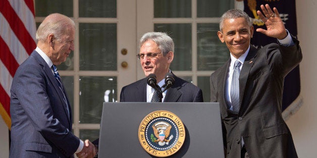 Federal appeals court judge Merrick Garland, center, stands with President Barack Obama and Vice President Joe Biden after being introduced as Obama's nominee for the Supreme Court during an announcement in the Rose Garden of the White House, in Washington, Wednesday, March 16, 2016. Garland, 63, is the chief judge for the United States Court of Appeals for the District of Columbia Circuit, a court whose influence over federal policy and national security matters has made it a proving ground for potential Supreme Court justices. (AP Photo/Pablo Martinez Monsivais)