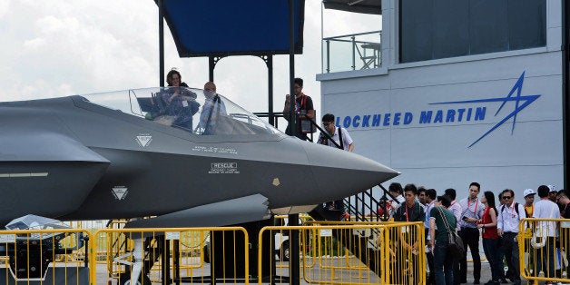 Visitors queue to have closer look at a static display of a Lockheed Martin F-35 at the Singapore Airshow in Singapore on February 18, 2016. Asia's largest aerospace and defence event is taking place from February 16 to 21. AFP PHOTO / ROSLAN RAHMAN / AFP / ROSLAN RAHMAN (Photo credit should read ROSLAN RAHMAN/AFP/Getty Images)