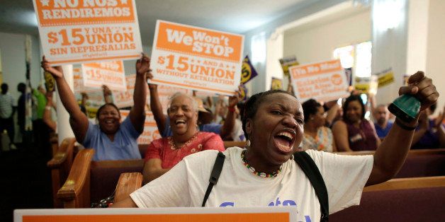 Activist Paulette Darow rings a cow bell as protestors listen to speeches at the Greater Bethel AME Church in support of raising the minimum wage to $15 an hour as part of an expanding national movement known as Fight for 15, Wednesday, April 15, 2015, in Miami. (AP Photo/Lynne Sladky)