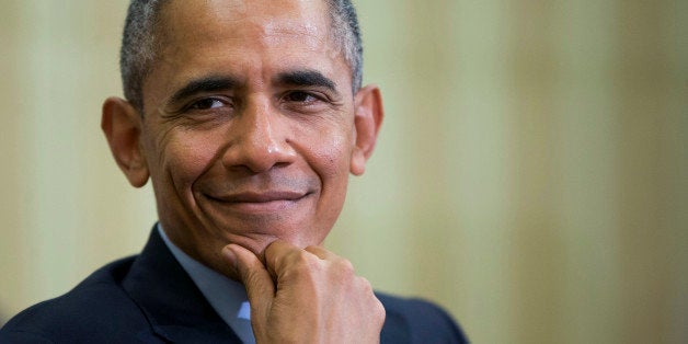 President Barack Obama smiles as he listens to Irish Prime Minister Enda Kenny speak during their meeting in the Oval Office of the White House in Washington, Tuesday, March 15, 2016. (AP Photo/Pablo Martinez Monsivais)