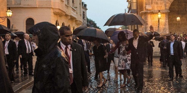 US President Barack Obama and First Lady Michelle Obama visit the Catedral de los Angeles during a tour of Old Havana on March 20, 2016. Obama arrived in Cuba to bury the hatchet in a more than half-century-long Cold War conflict that turned the communist island and its giant neighbor into bitter enemies. AFP PHOTO/Nicholas KAMM / AFP / NICHOLAS KAMM (Photo credit should read NICHOLAS KAMM/AFP/Getty Images)