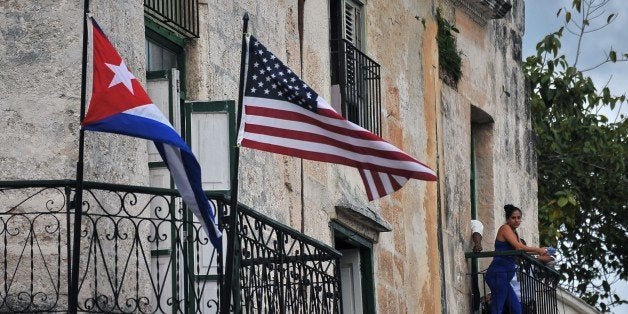 Cuban and US flags are seen on balconies in Havana on March 20, 2016. On Sunday, Obama became the first US president in 88 years to visit Cuba, touching down in Havana for a landmark trip aimed at ending decades of Cold War animosity. AFP PHOTO/YAMIL LAGE / AFP / YAMIL LAGE (Photo credit should read YAMIL LAGE/AFP/Getty Images)