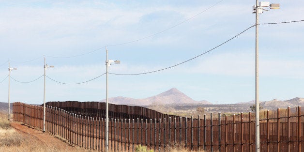 United States Mexico border fence illegal immigration barrier from the American side.