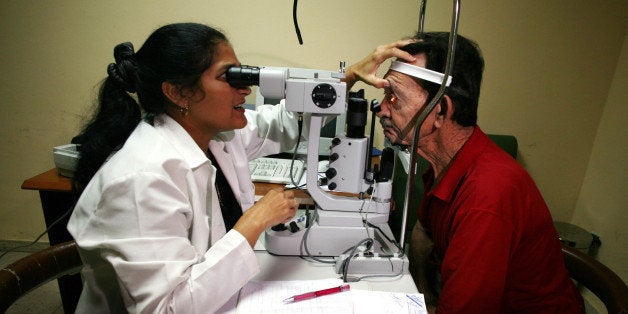 CUBA - SEPTEMBER 12: A Cuban doctor looks the crystalline lens of a patient at the Pando Ferrer Eyes Hospital, a model hospital in its specialty, in Havana, Cuba, Tuesday, September 12, 2006. (Photo by Diego Giudice/Bloomberg via Getty Images)