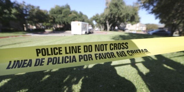 FILE - In this Oct. 15, 2014 file photo, police tape marks where the media is set up, in Dallas. Amid the national focus on deadly police shootings, records show scores of Dallas officers remain on the job despite being punished for serious offenses such as theft, excessive force and lying. (AP Photo/LM Otero, File)