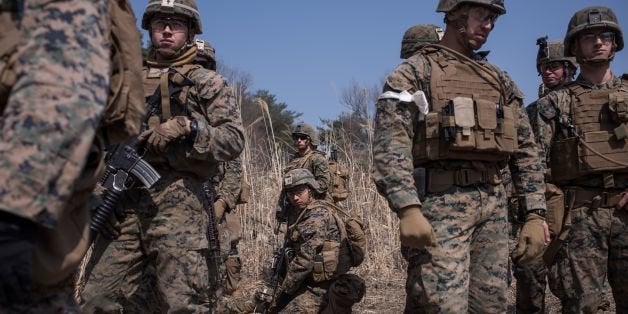 In a photo taken on March 15, 2016 US soldiers of the 31st Marine Expeditionary Unit infantry take part in a live fire drill during an exercise entitled 'Ssang Yong', near South Korea's southeastern port city of Pohang.Ssang Yong, meaning 'twin dragons', is a biennial military exercise 'focused on strengthening the amphibious landing capabilities of the U.S. and its allies', according to the US Pacific Command. The 11-day exercise brings together US Marines of the 13th and 31st Marine Expeditionary Units and their South Korean counterparts. On March 12, North Korea hit out at Washington and Seoul, pledging to launch a blitzkrieg in the Korean peninsula, with the official KCNA news agency, citing a statement from military chiefs, warning of a 'pre-emptive retaliatory strike at the enemy groups' involved in the joint US-South Korean exercise. / AFP / Ed Jones (Photo credit should read ED JONES/AFP/Getty Images)