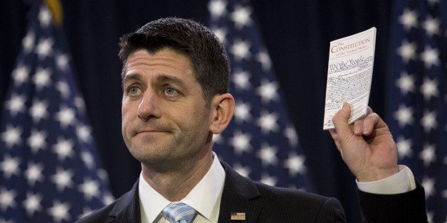 U.S. House Speaker Paul Ryan, a Republican from Wisconsin, holds a copy of the Constitution while speaking at the Capitol in Washington, D.C., U.S., on Wednesday, March 23, 2016. Ryan's call in a speech on Wednesday for elevating the political debate to inspire and unite Republicans carried a huge, unspoken subtext: Donald Trump. Photographer: Drew Angerer/Bloomberg via Getty Images 